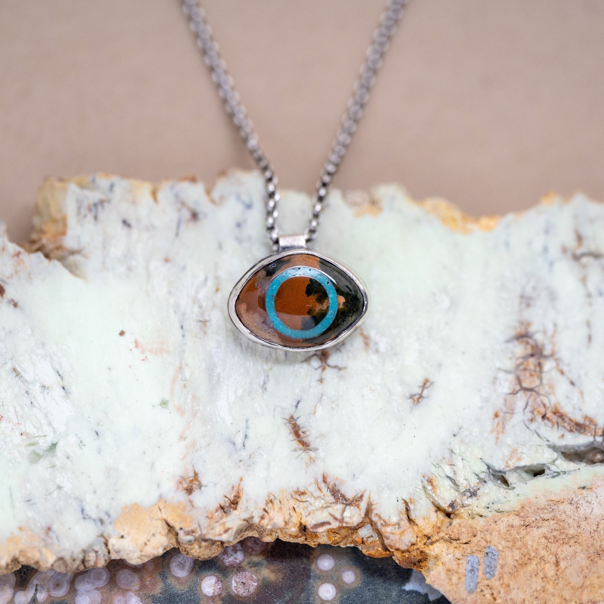 Necklace with a pendant on a piece of crystal rock