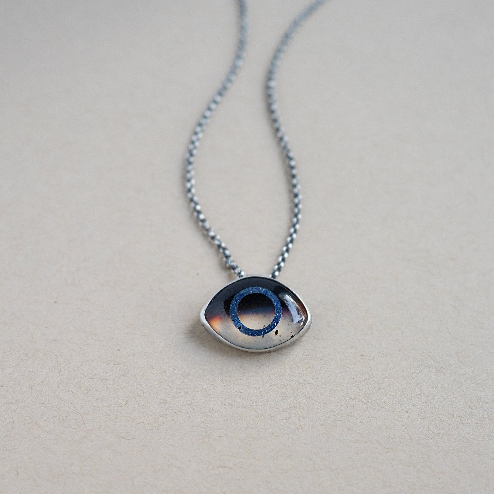 Necklace with a Montana Agate eye pendant set in sterling silver 
