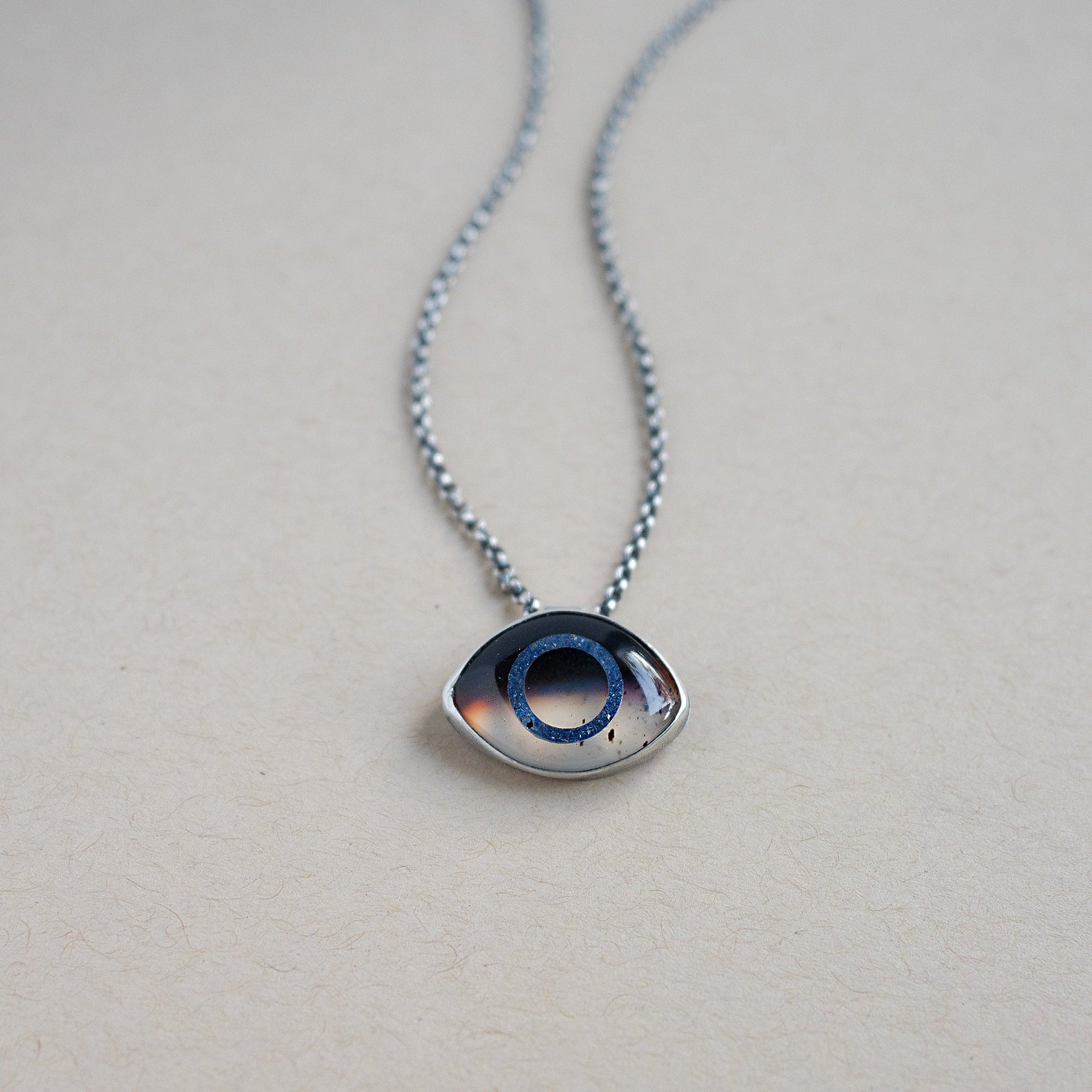 Necklace with a Montana Agate eye pendant set in sterling silver 