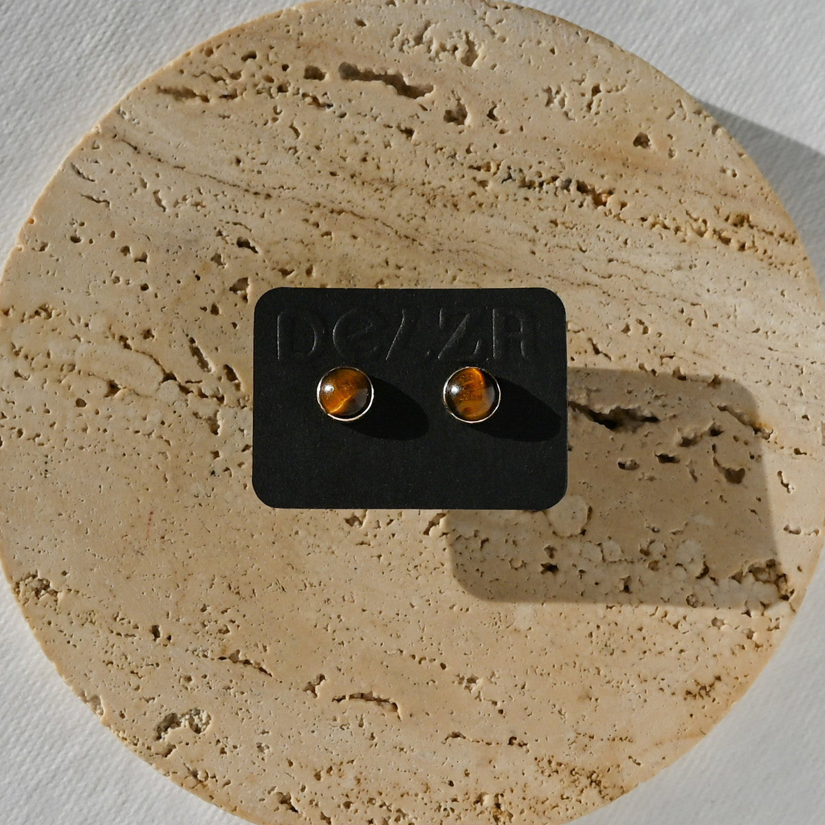 TIGER EYE STUDS ON A BLACK DELZA CARD