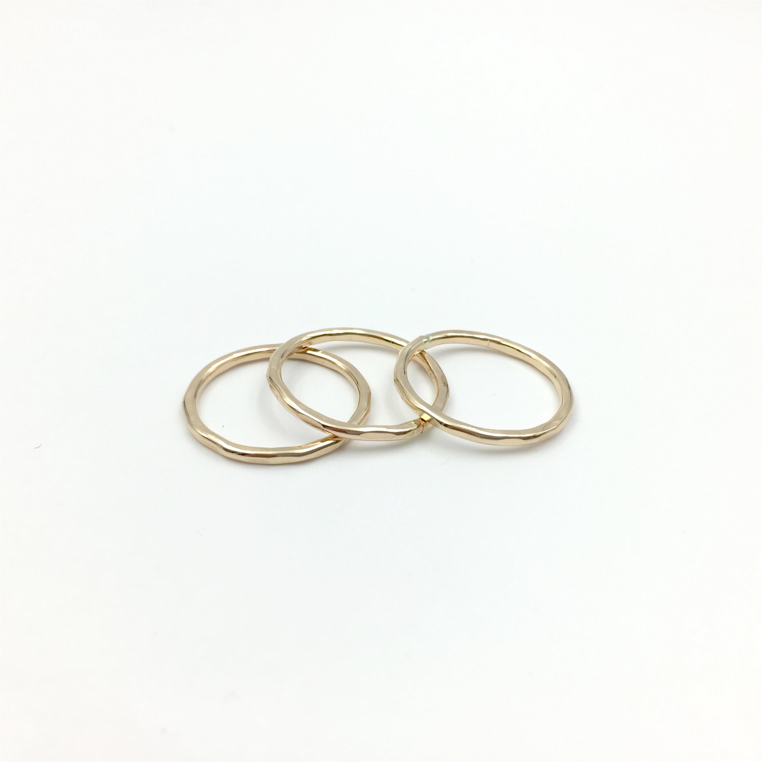 Hammered stacking rings in 14k gold fill by Knucklekiss